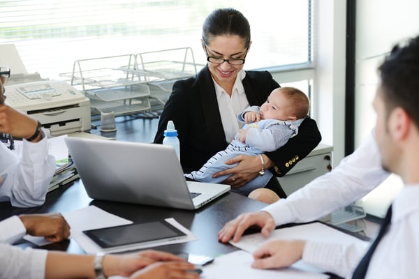 Business people taking care of baby in office-1