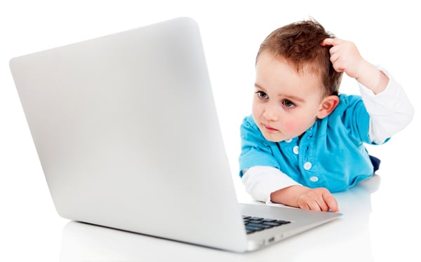 Confused boy with a laptop computer - isolated over a white background-1