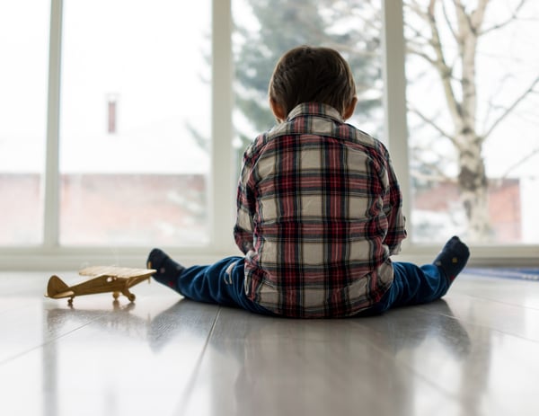 Sad kid sitting on floor-1