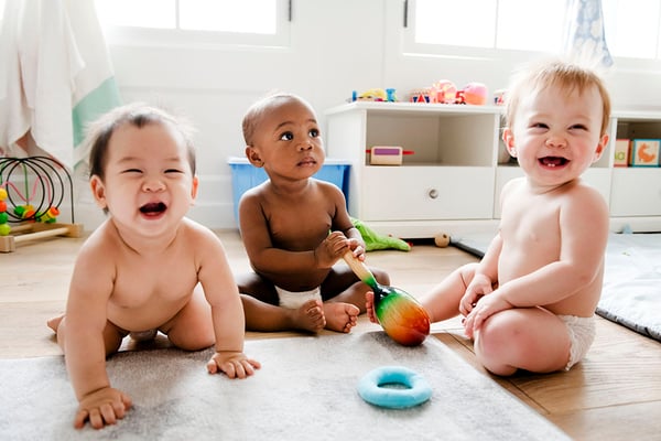 smiling babies playing together